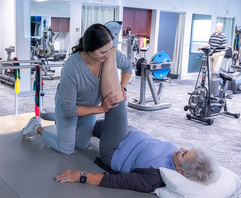 physical therapist with patient